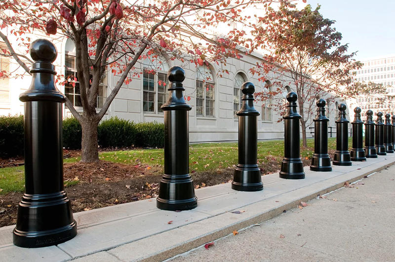 A busy pedestrian zone secured with heavy-duty cast iron bollards