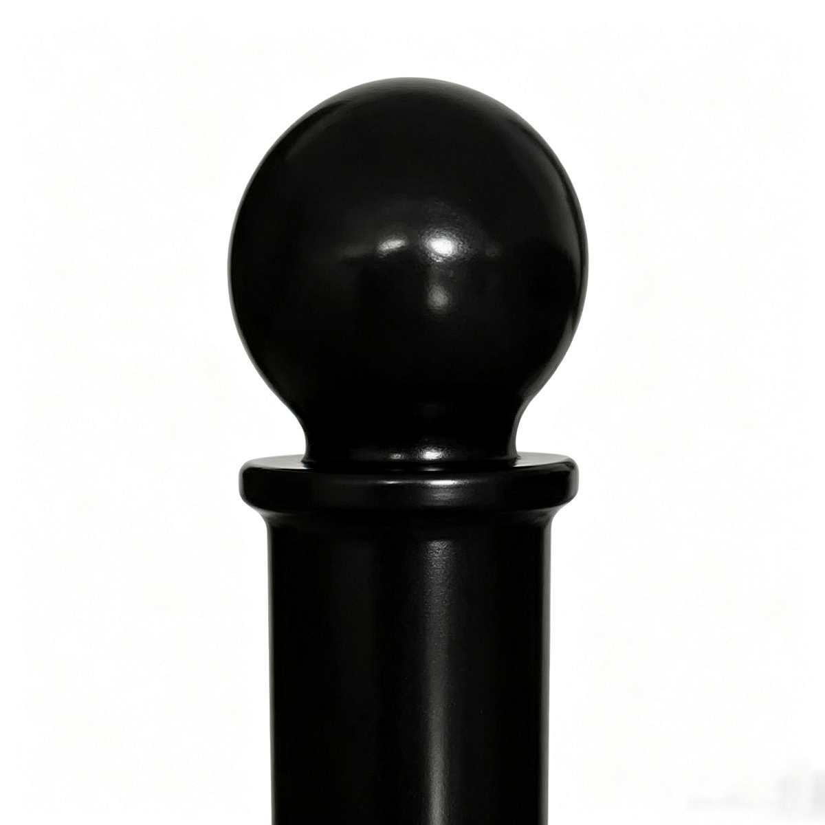 Close-up view of glossy black spherical top finial of lockable cast iron bollard HS-CB001