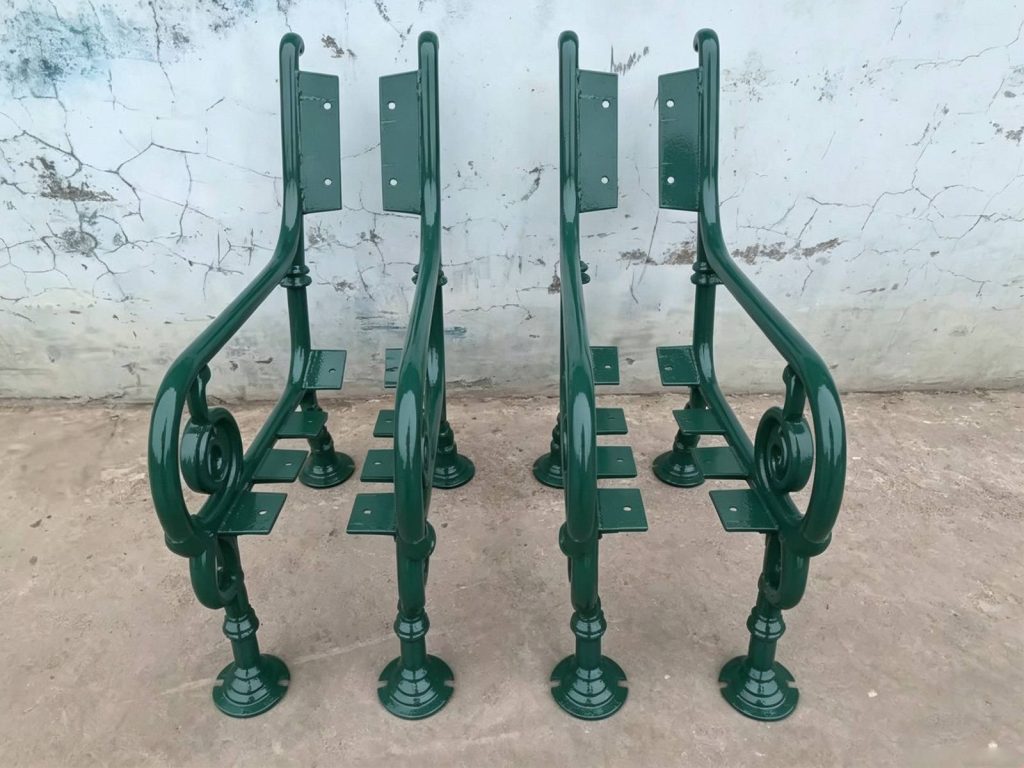 Pair of cast iron street bench legs, green powder coated bench side frames, pre‑drilled mounting plates **Title**: Pair of Cast Iron Bench Leg Frames