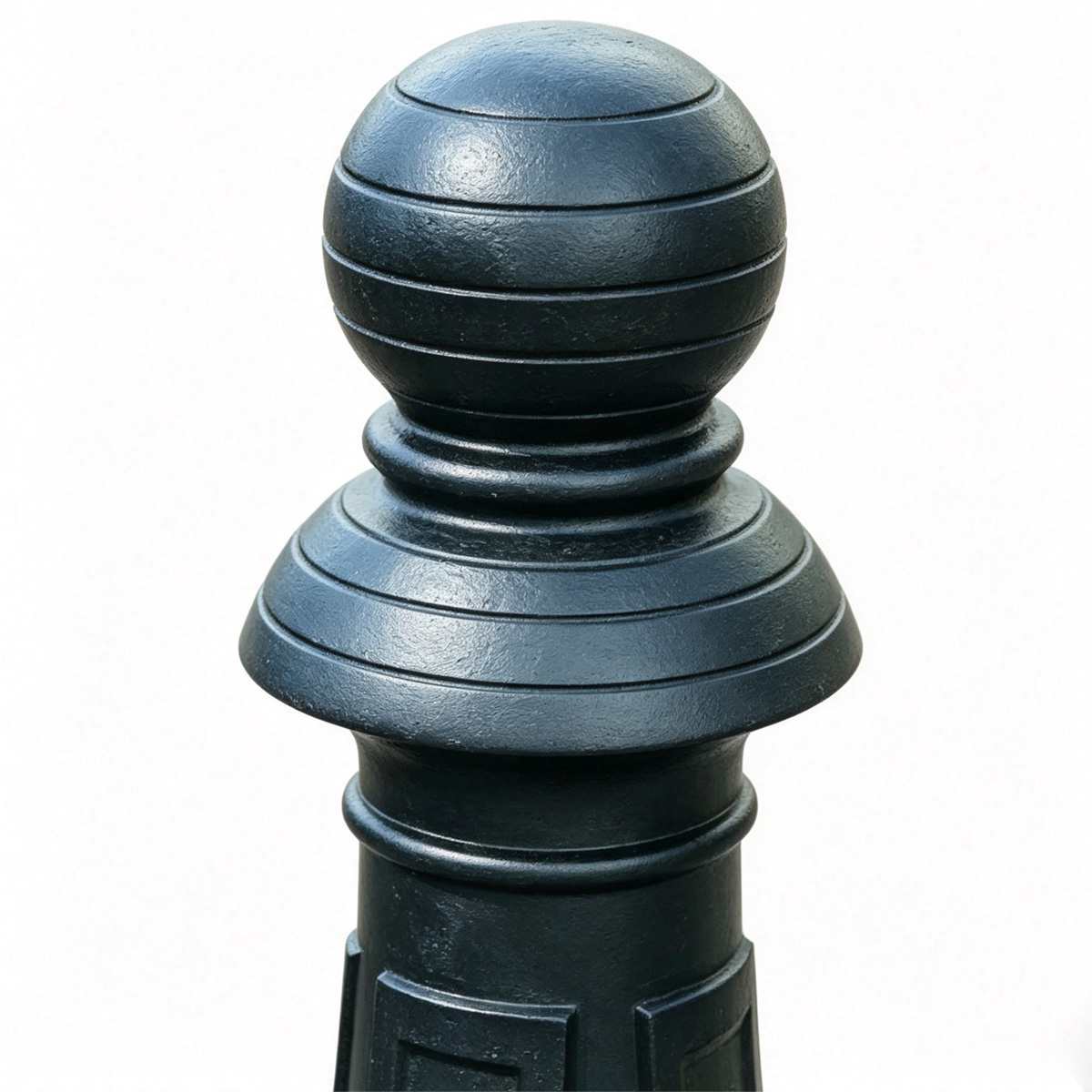 Close-up of grooved spherical top finial of vintage black cast iron bollard, layered carved decorative cap
