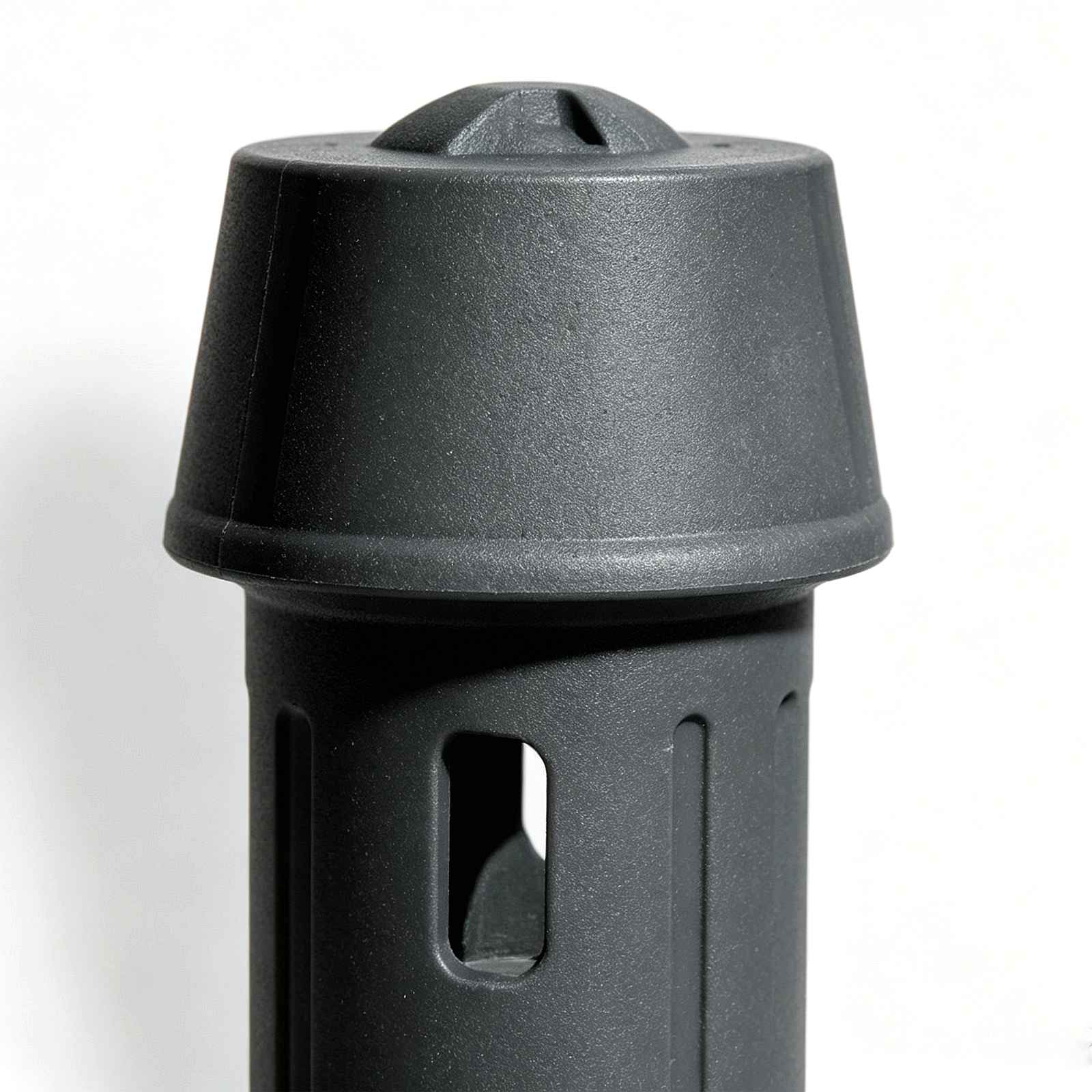 Close‑up detail shot of black plastic bollard top cap and upper body cut‑out slots