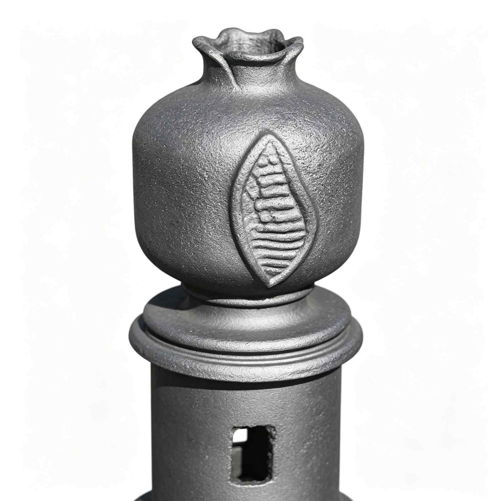 Close‑up of decorative cast iron bollard, pomegranate finial with embossed leaf carving