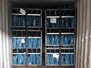 Interior view of a 1x20GP container loaded with decorative columns and chair legs on metal racks for Bulgaria shipment.