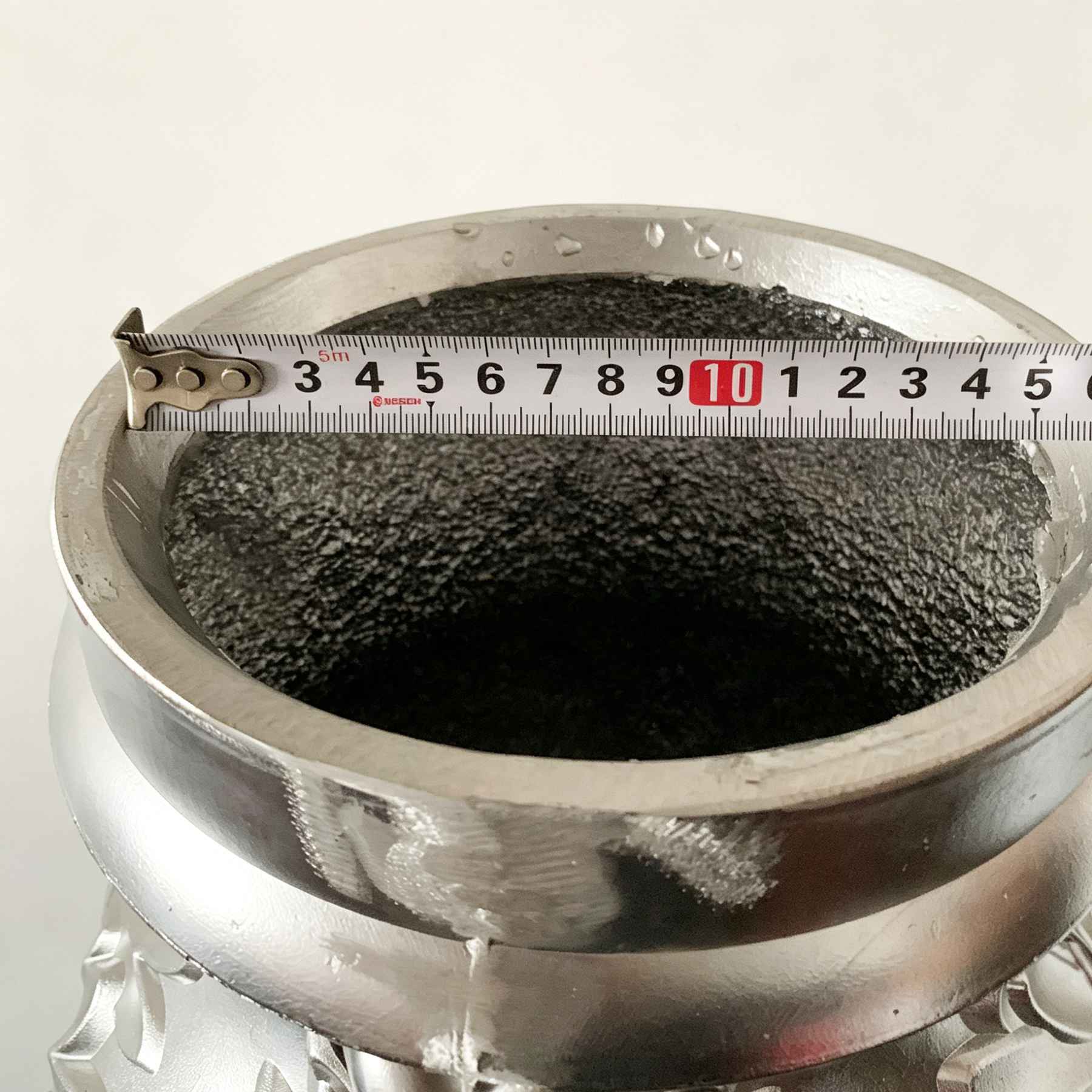 Close-up of cast aluminum lamp post top opening showing internal galvanized structure, confirming material density and corrosion resistance for outdoor durability.