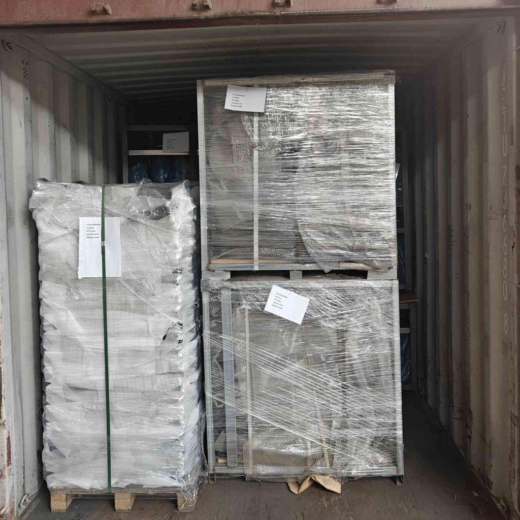 Cast iron bollards packed in pallets and metal crates, container loading for Bulgaria shipment