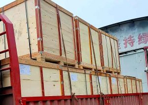Loaded truck with outdoor lighting accessories in wooden crates ready for LCL shipping to Spain.