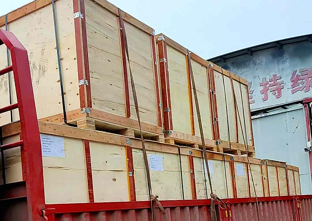 Loaded truck with outdoor lighting accessories in wooden crates ready for LCL shipping to Spain.