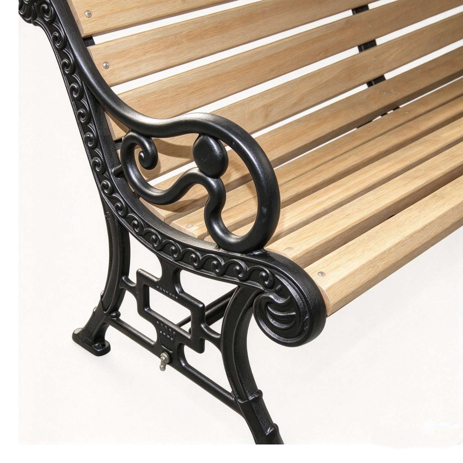 Closeup view of carved scroll cast iron leg and armrest for garden bench, black powder coated cast iron structure
